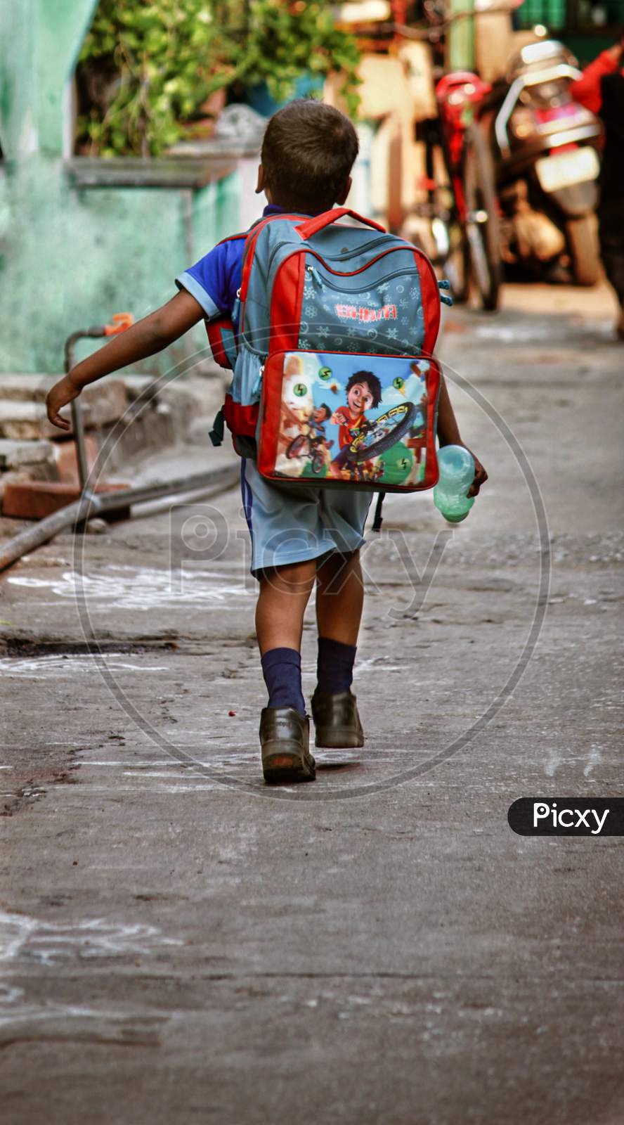 School Going Boy in an Street Walking Wearing Uniform And School Bag