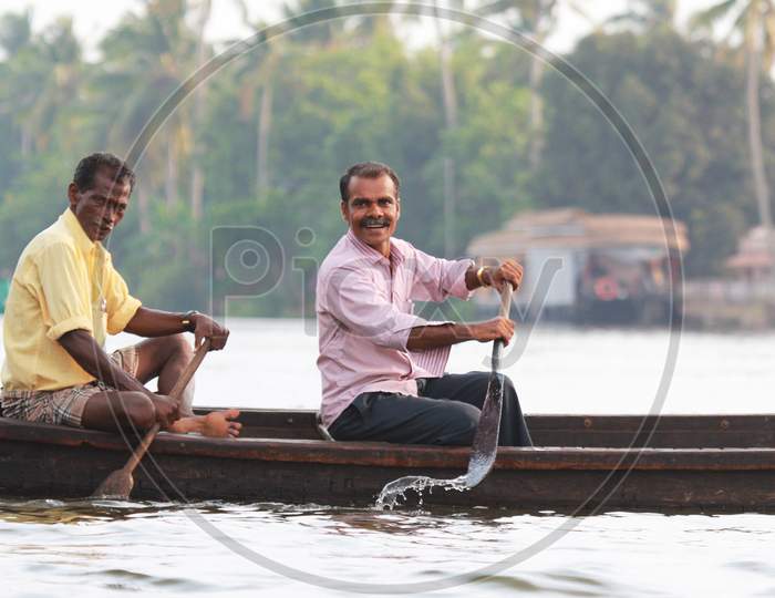 Indian Men Rowing the Boat at Alappuzha, Kerala, India