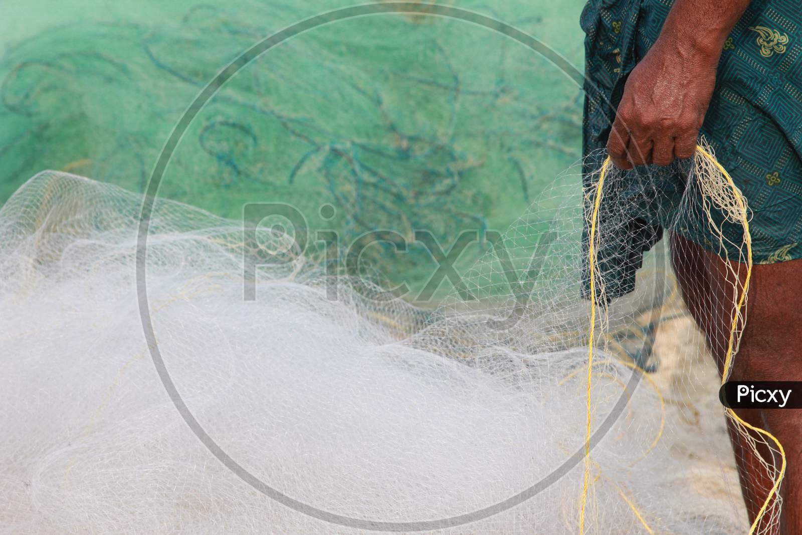 Indian Fisher man With Fishing Nets