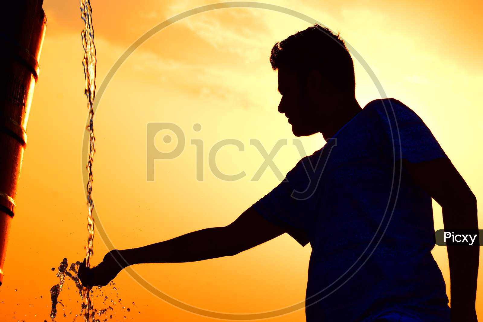Silhouette Of man Playing With Water