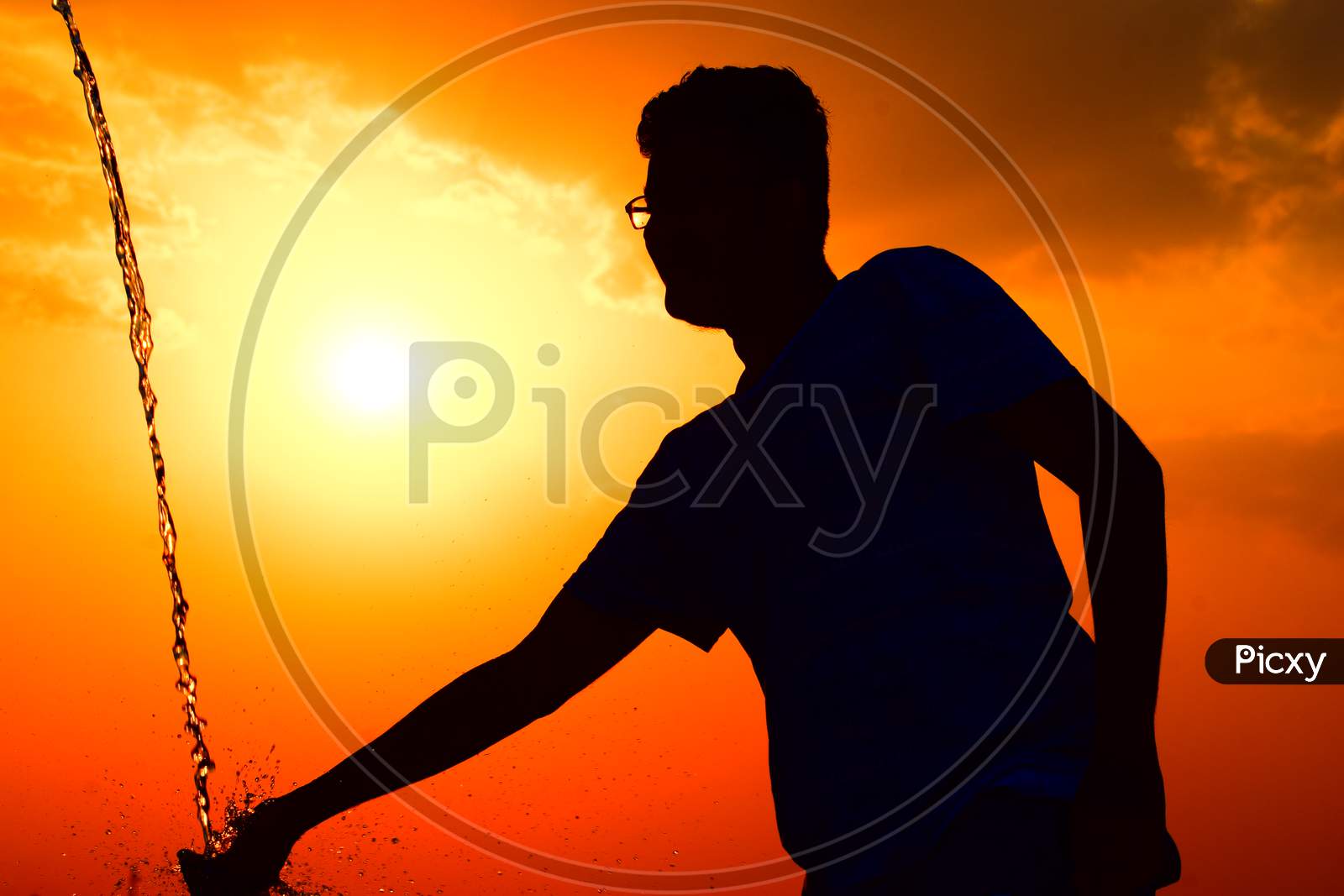 Silhouette Of man Playing With Water