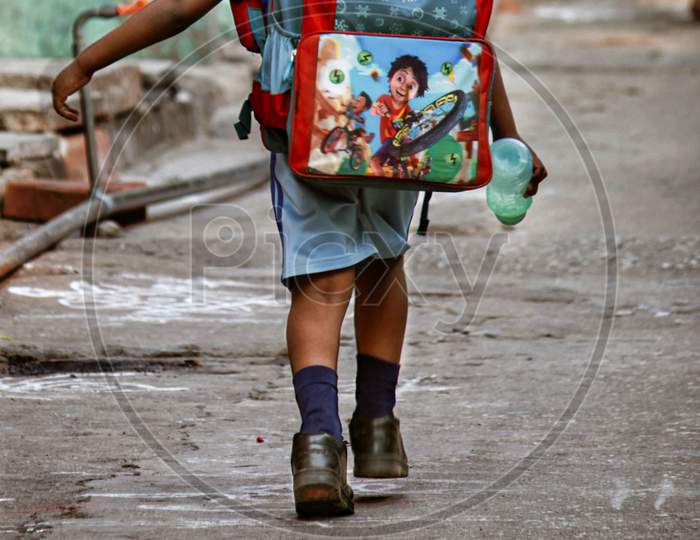 School Going Boy in an Street Walking Wearing Uniform And School Bag