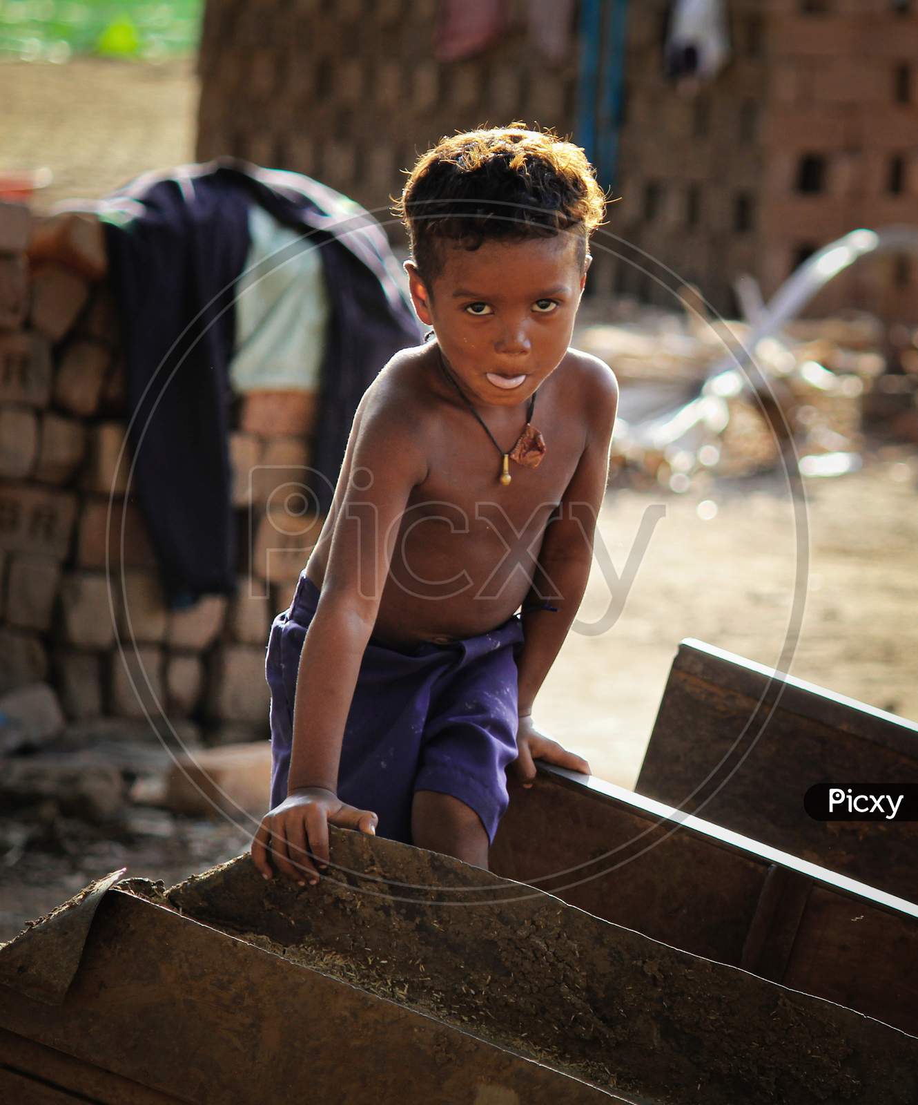 A boy in brickyard