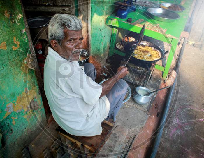 Street Food Vendor Making Snacks At a Shop