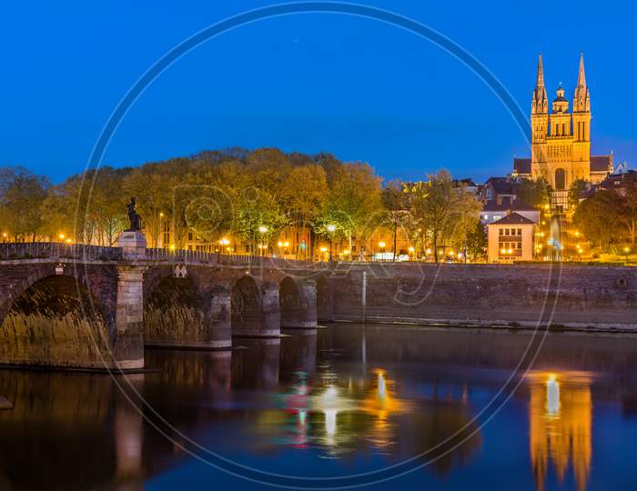 Night View Of Angers With Verdun Bridge And Saint Maurice Cathedral - France