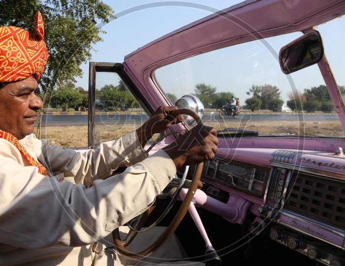 View of Rajasthani man driving an Antique car