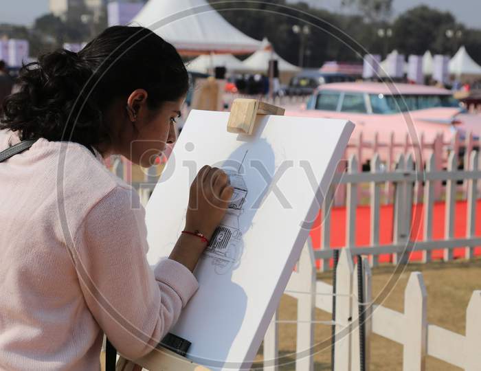 Indian Girl drawing a sketch
