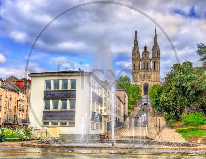 Fountain And Saint Maurice Cathedral Of Angers In France