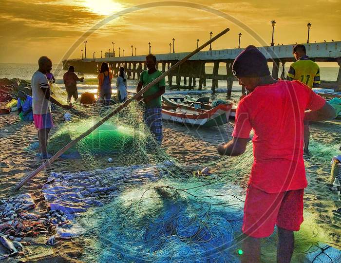 Fisherman In an Beach With Fishing Nets