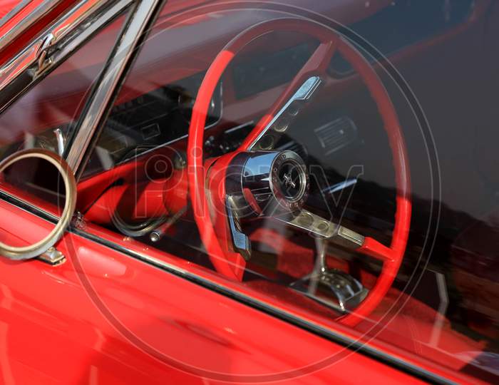 Retro red steering wheel of a car