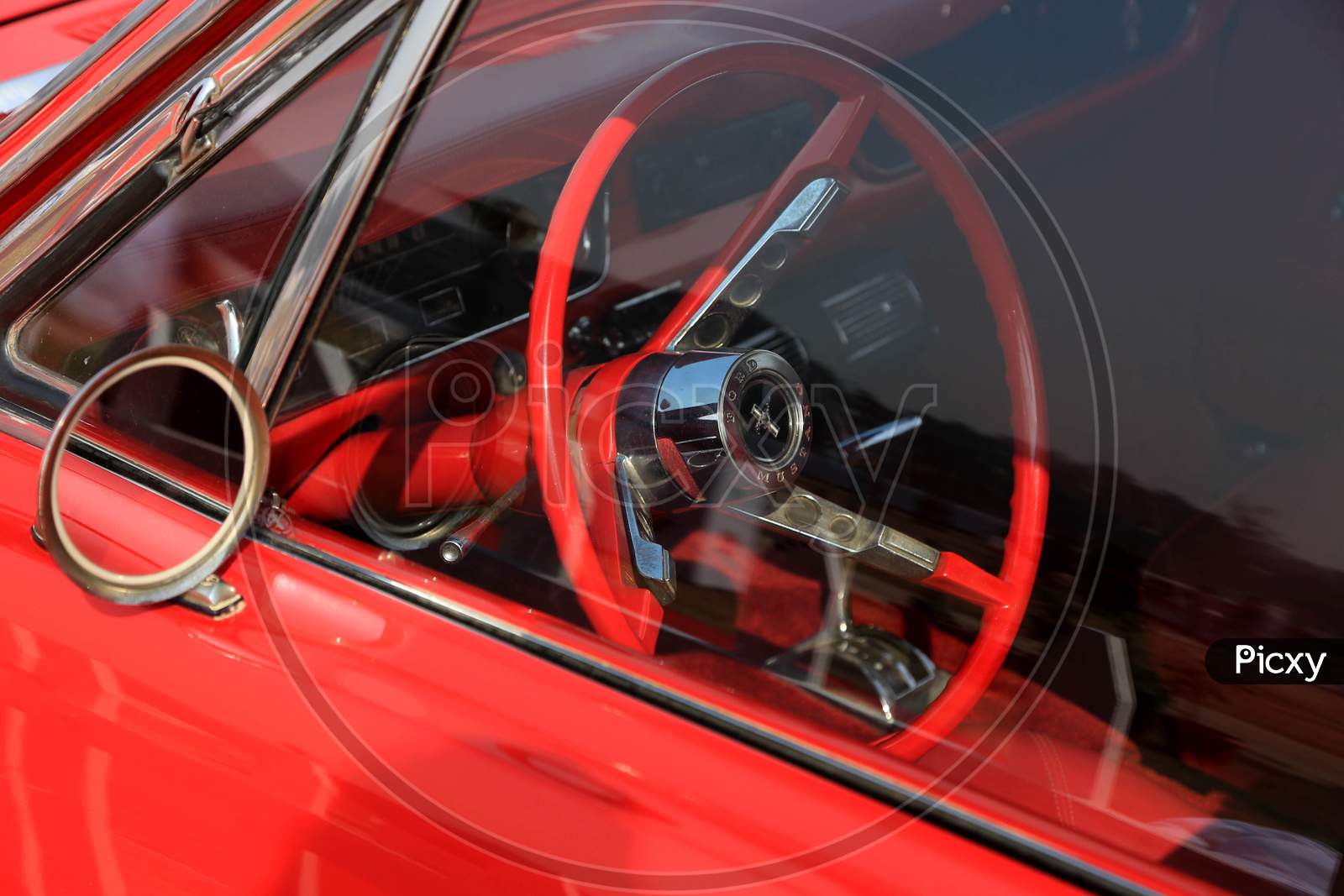Retro red steering wheel of a car