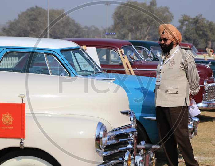 Indian Sikh Man checking Retro Cars