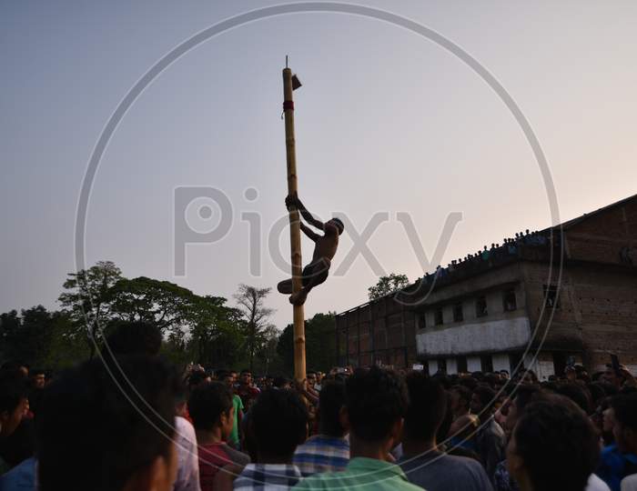 People Playing Pole Climbing  During Suwori Festival Celebrations in Boko, Assam