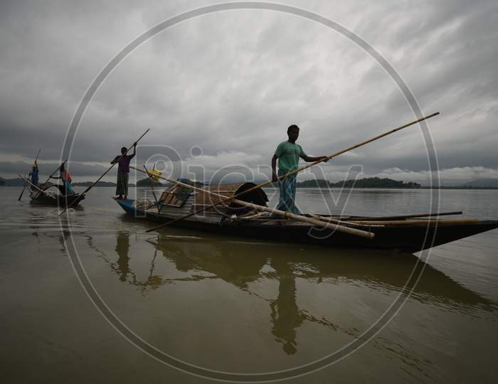 Fisherman in Boats Fishing on Bramhaputra River