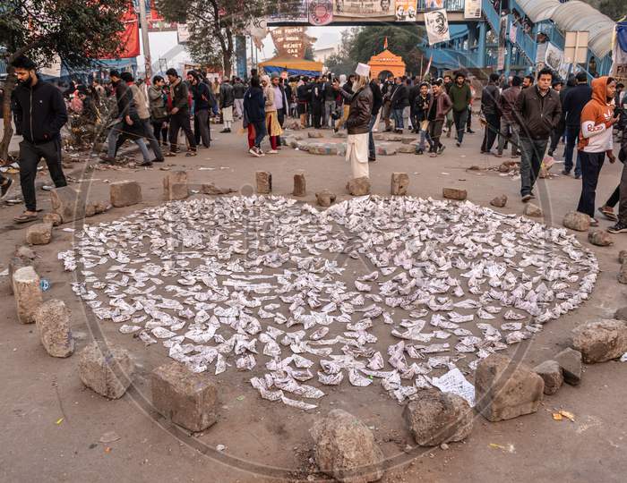 Hundreds of Paper Boats with inscription from famous poet Faiz Ahmad Faiz's Ham Dekhengay put by protesters at Shaheen Bagh