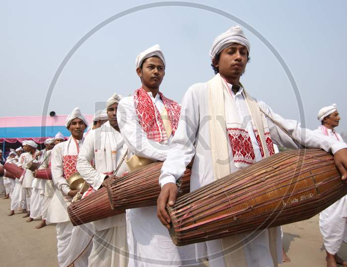 Artists Playing Dholak or Drums in Bihu Festival Celebrations
