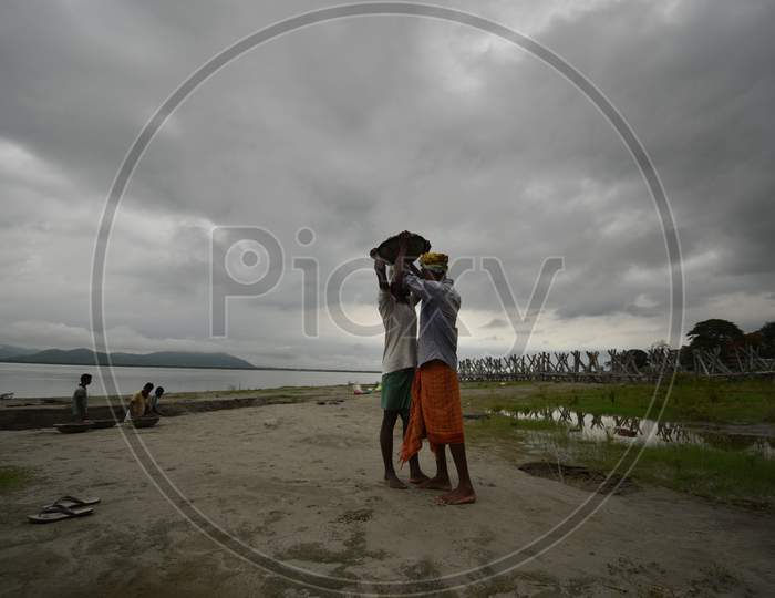 Workers Carrying Sand From Bramhaputra River Bank