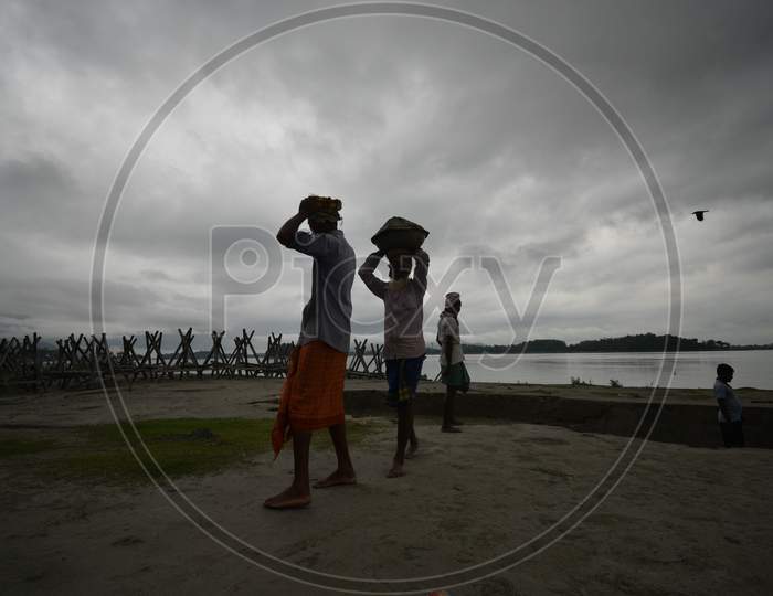 Workers Carrying Sand From Bramhaputra River Bank
