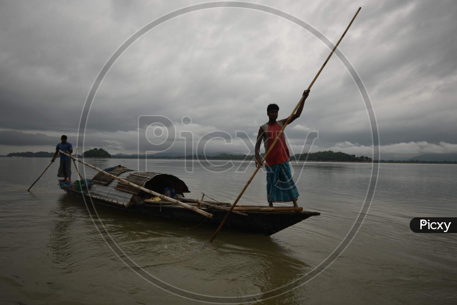 Image of Fisherman in Boats Fishing on Bramhaputra River-BP690293-Picxy