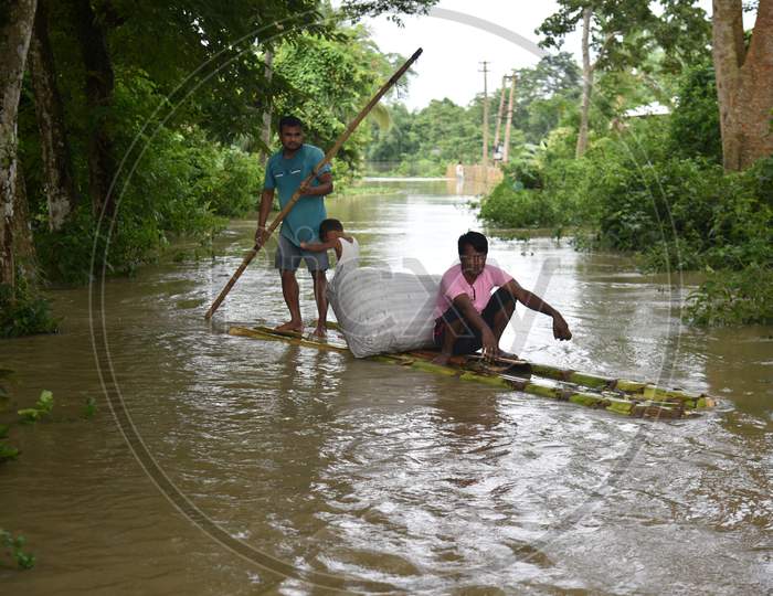 Villagers On Make Shift Raft Boats On Flooded Regions of Golaghat Region in Assam