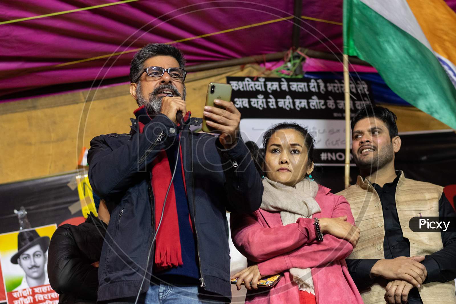 Actor Sushant Singh and his wife Molina Singh speaking on stage at shaheen Bagh during protest against Citizenship Amendment Act CAA, National Register Of Citizens NRC and National Population Register NPR