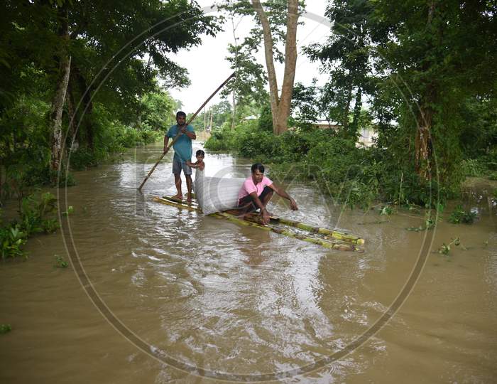 Villagers On Make Shift Raft Boats On Flooded Regions of Golaghat Region in Assam