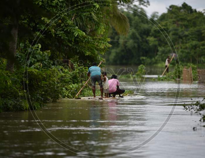 Villagers on Makeshift Raft Boats Due  To Floods In Golaghat , Assam