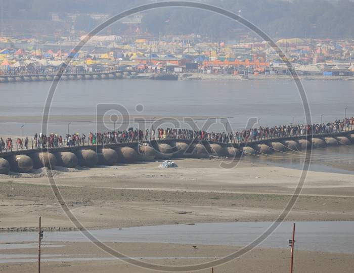 Hindu Devotees And  Sadhu Crossing Bridge in Prayagraj  During Magh Mela