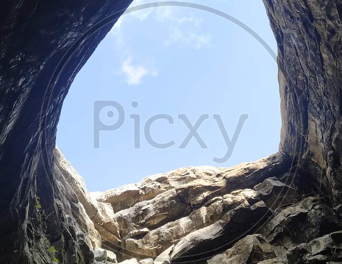 Canopy of  a Rock Cave With Blue Sky as Background