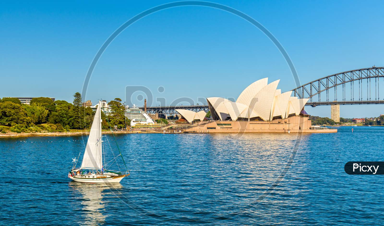 Sydney Opera House And A Yacht In The Harbour - Australia