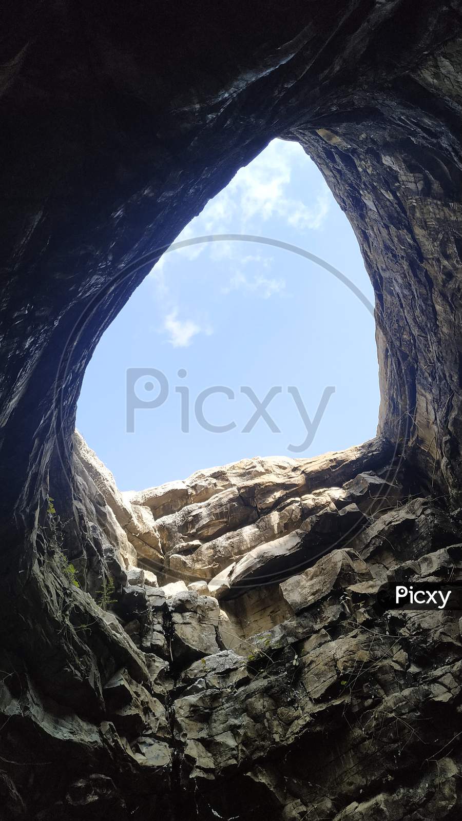 Canopy of  a Rock Cave With Blue Sky as Background