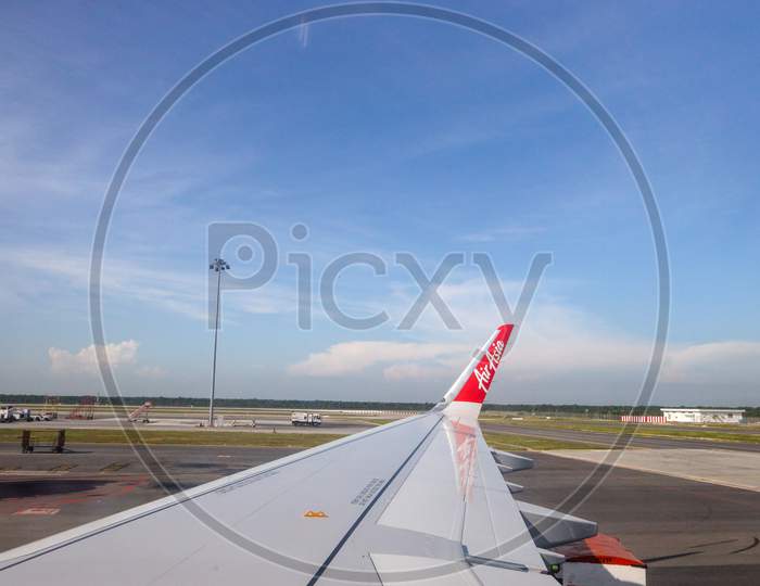A View Of Air Asia Flight Wing From Fight Window