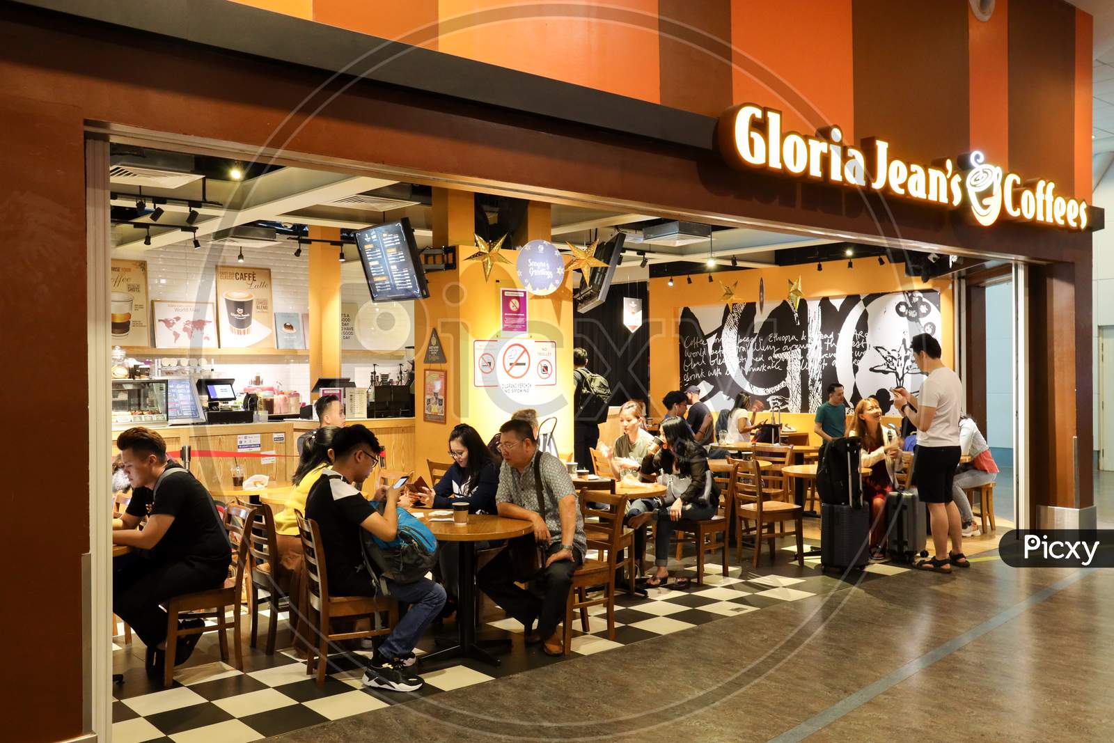 Passengers Having Coffee in Gloria Jeans Coffees At KL International Airport , Malaysia