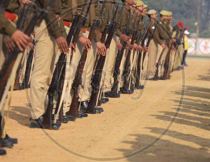 Indian Police Man  Standing In Lines With Guns At a Parade