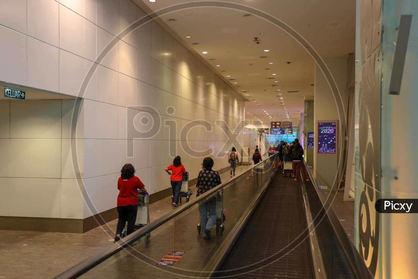 Passengers  Travel Scenes With Bags and Trolleys in KL International Airport, Malaysia
