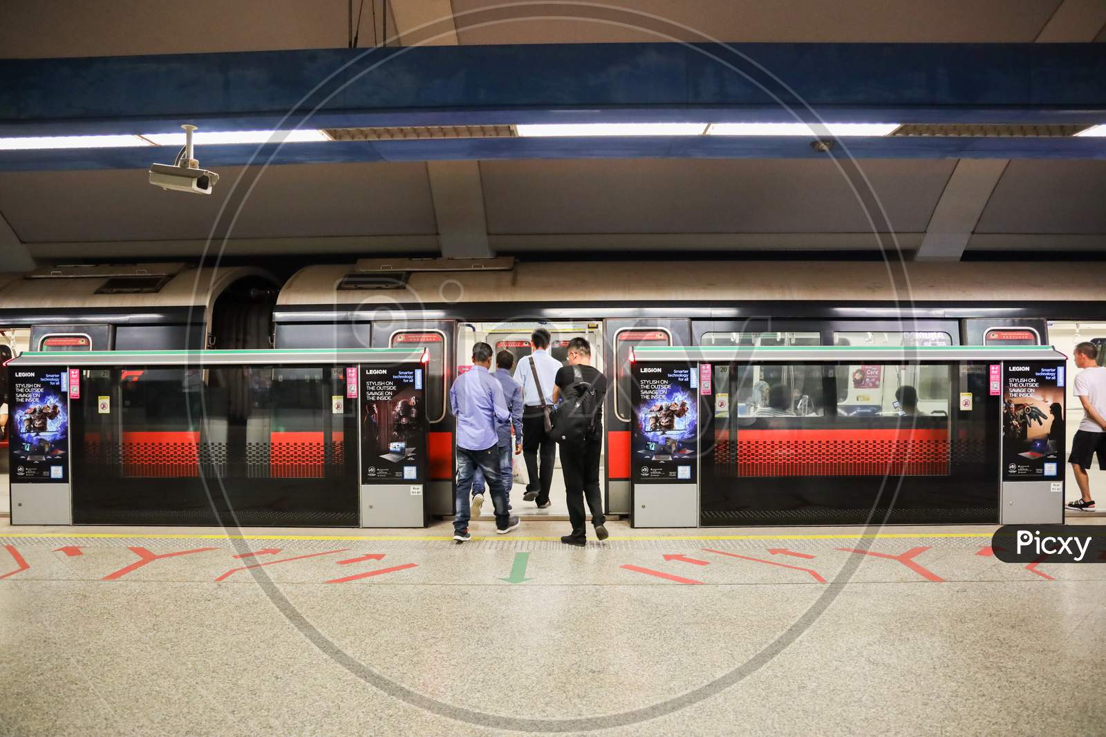 people Boarding Singapore Metro.