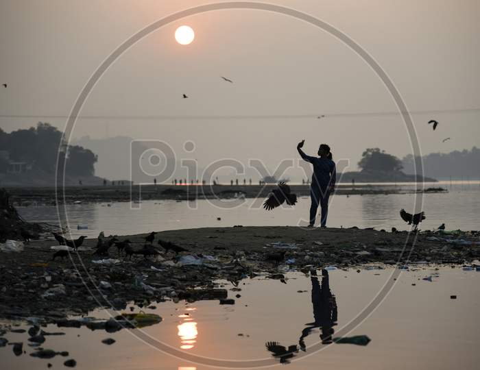 Silhouette Of Fisher Man On Bramhaputra River Bank , Guwahati