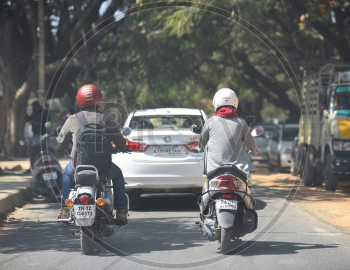 Two wheeler commuters using Helmet