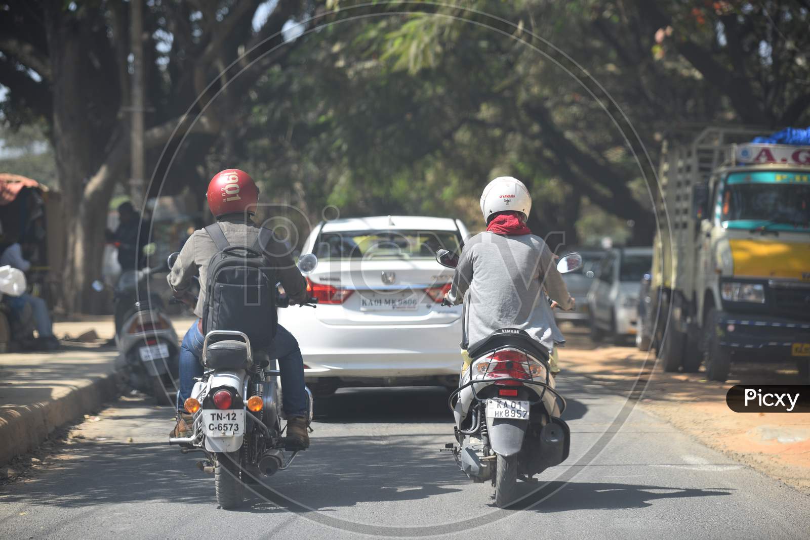 Two wheeler commuters using Helmet