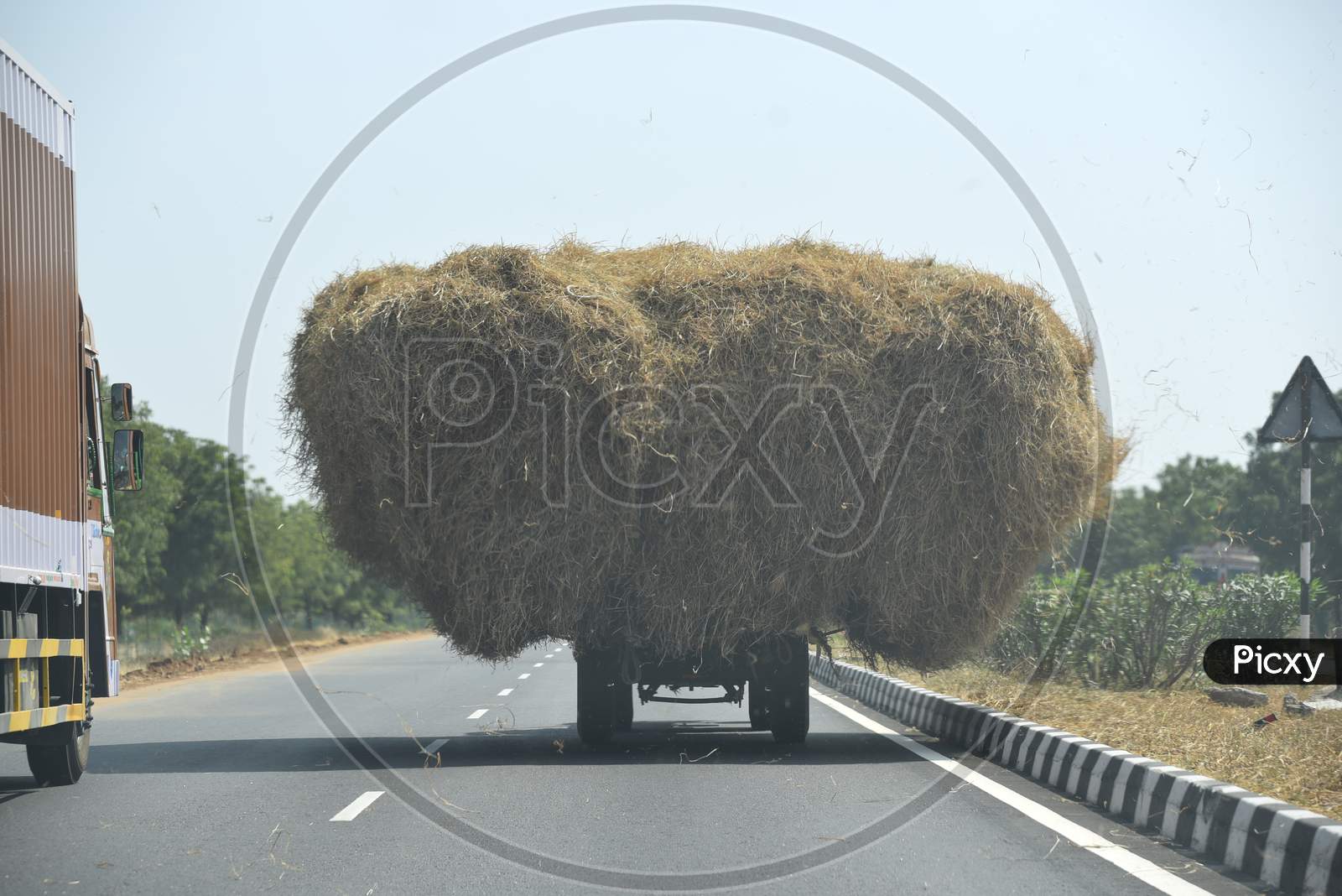 A tractor carrying Hay