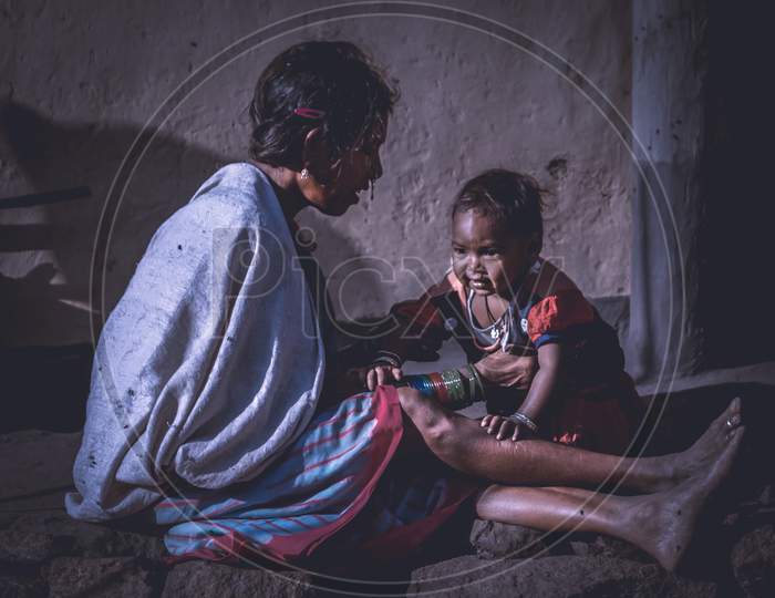 Indian Grand Mother With Grand Child in an  Rural Village House