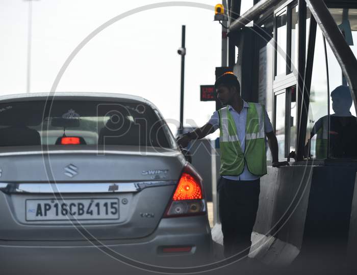 a toll collector at a Toll Plaza
