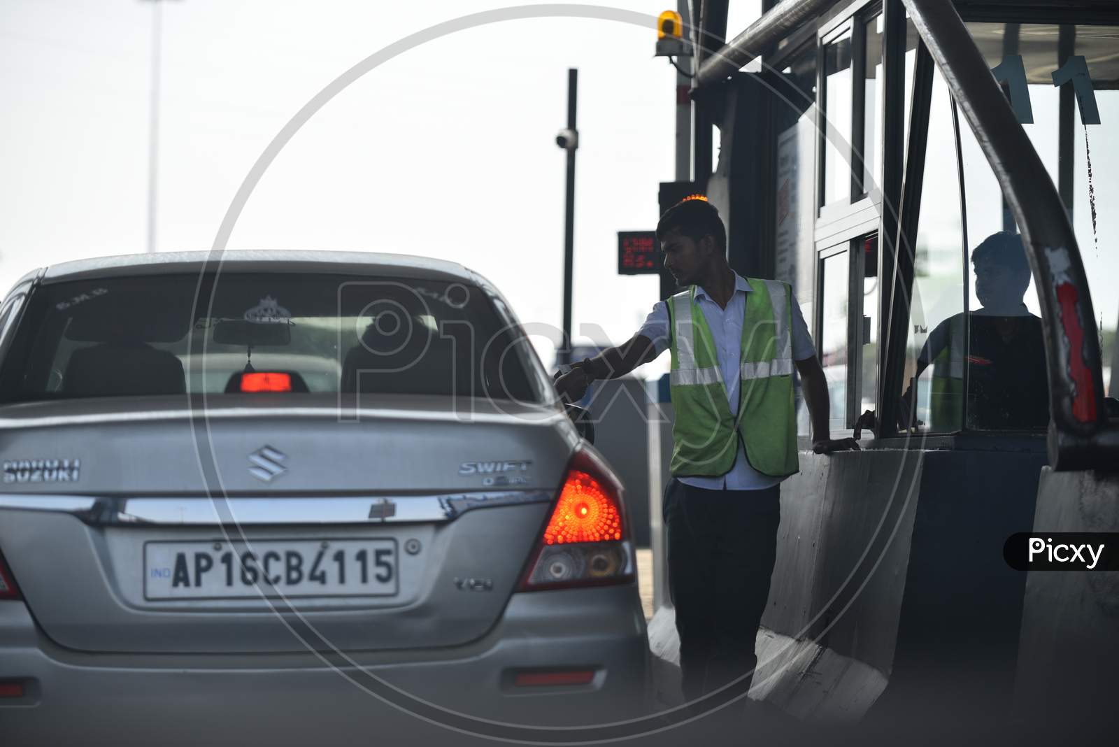 a toll collector at a Toll Plaza