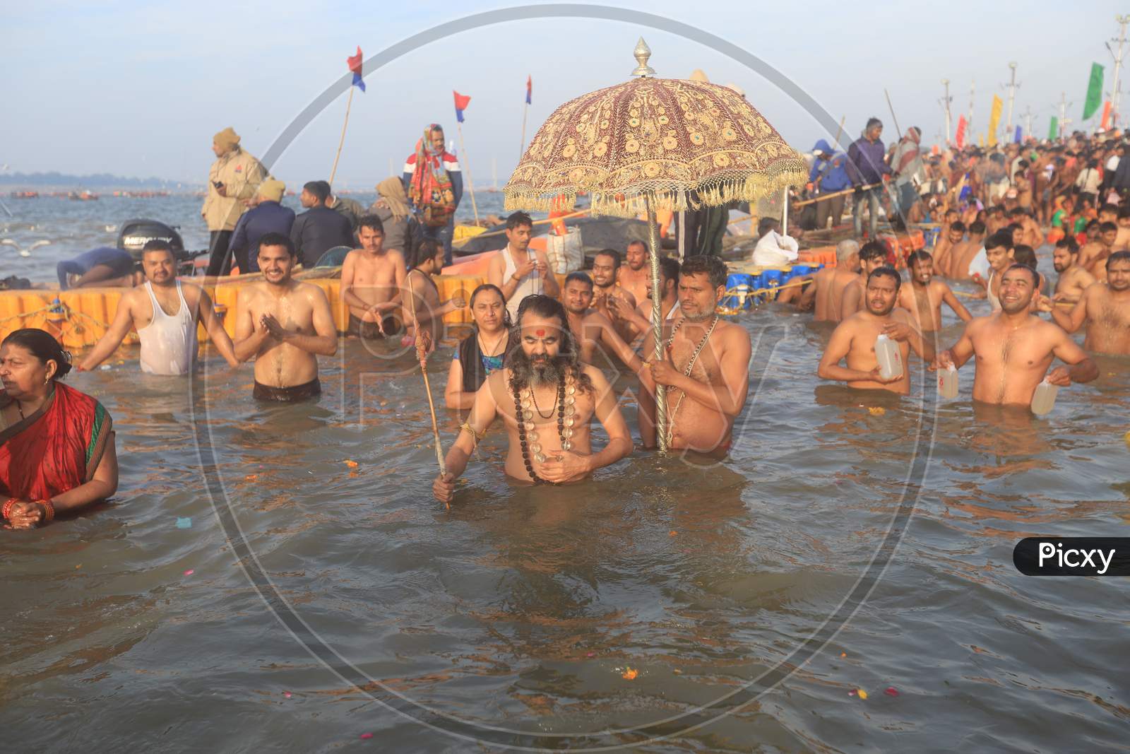 Crowd Of Hindu Devotees  And Sadhu  Taking Holy Bath In Triveni Sangam River At  Prayagraj  During  Magh Mela 2020 in Allahabad