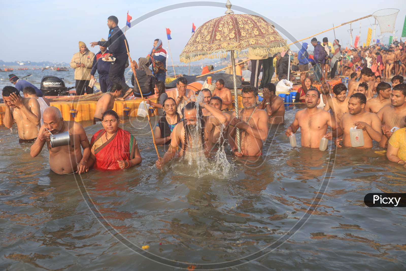 Crowd Of Hindu Devotees  And Sadhu  Taking Holy Bath In Triveni Sangam River At  Prayagraj  During  Magh Mela 2020 in Allahabad
