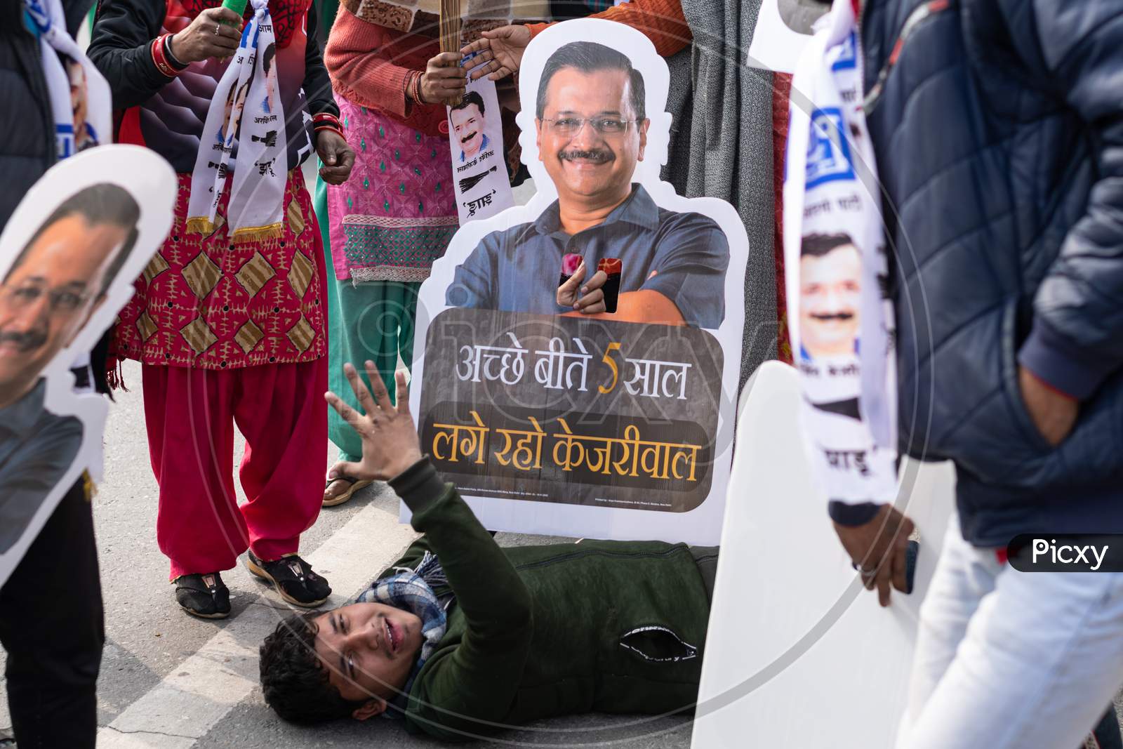 Aam Aadmi Party AAP supporter holding cutout of Arvind Kejriwal during a rally for Delhi Assembly Election