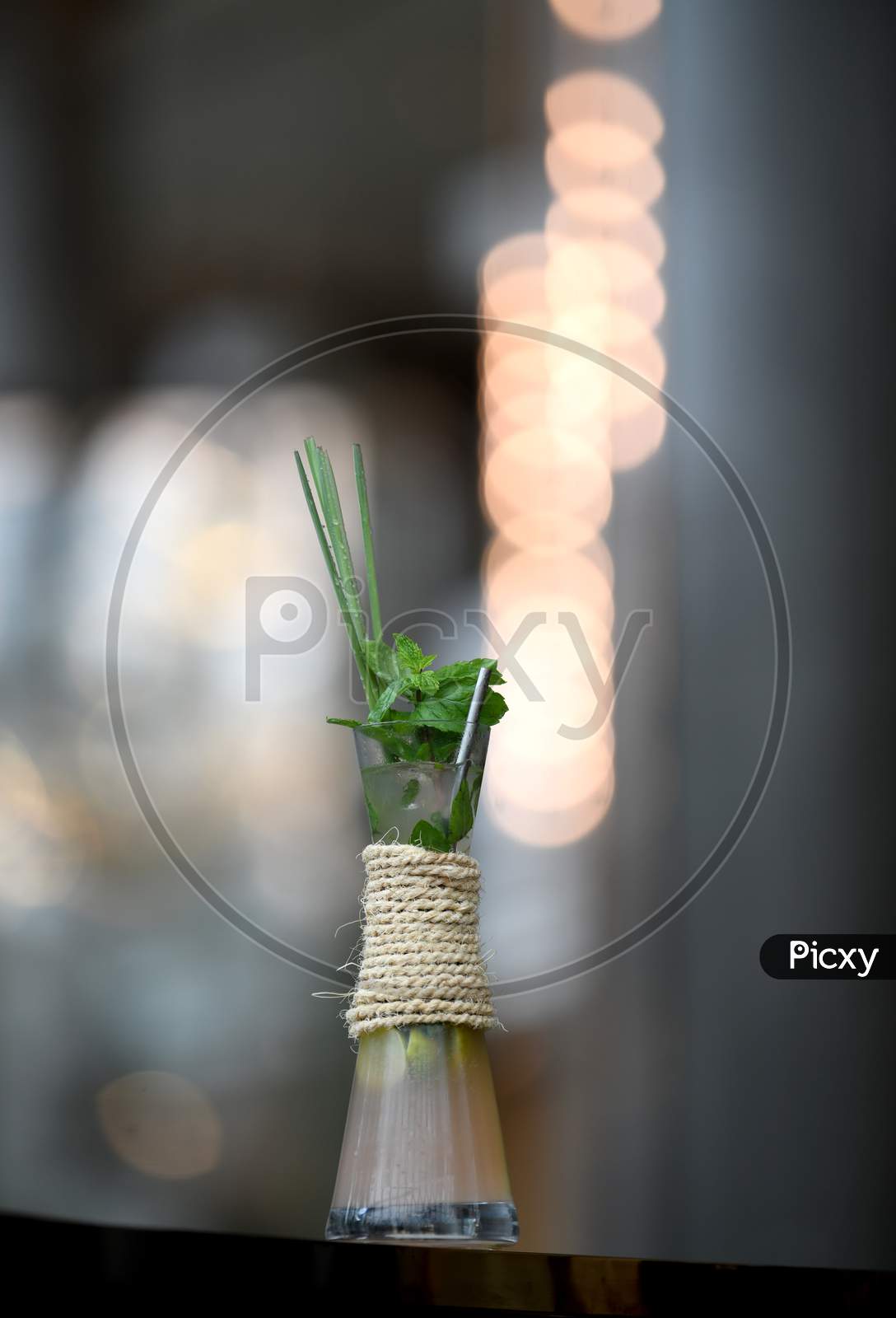 Mocktail Summer Cooler Drink With Lime, Soda And Ice  With a Adding Of  Rosemary and Mint Leaf