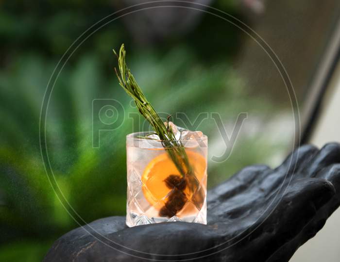 Mocktail Glass With Ice , Lime And  Rosemary