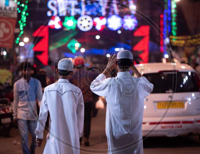 A Muslim Boy Wearing A Namaz Cap And Waling On a Street