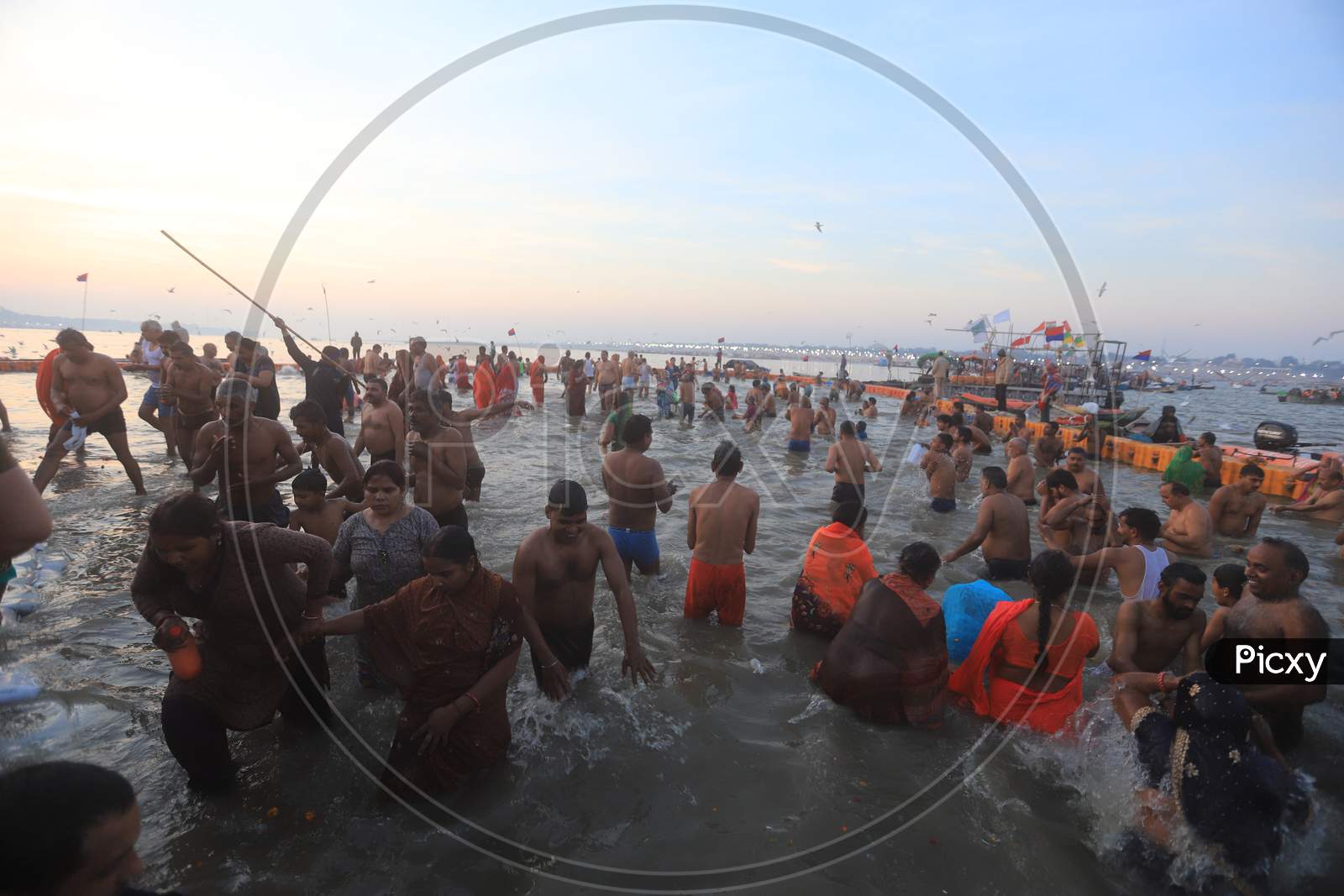 Image Of Crowd Of Hindu Devotees And Sadhu Taking Holy Bath In Triveni